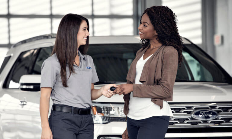 Person handing keys to Ford technician
